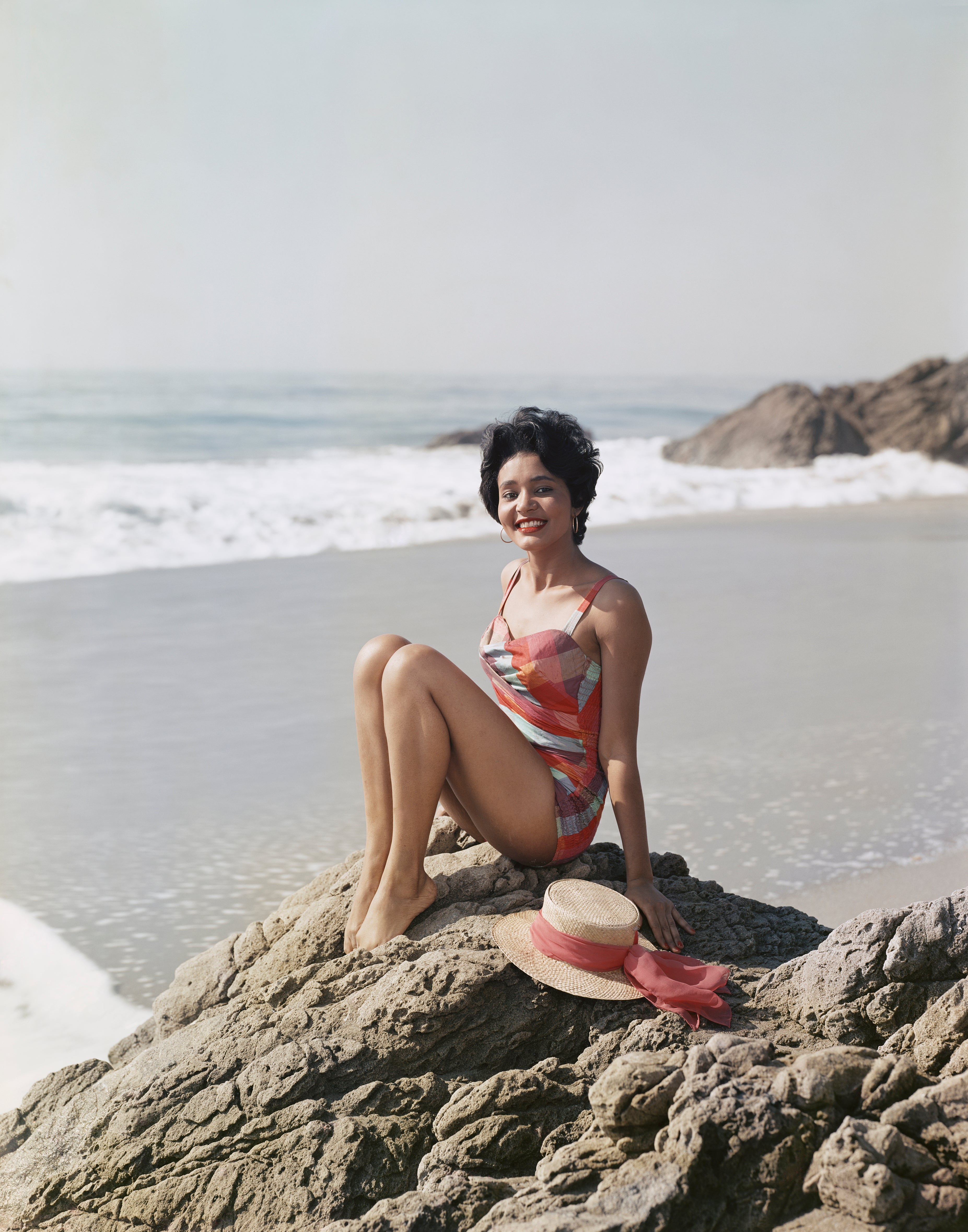 Young Woman Sitting Beside the Sea