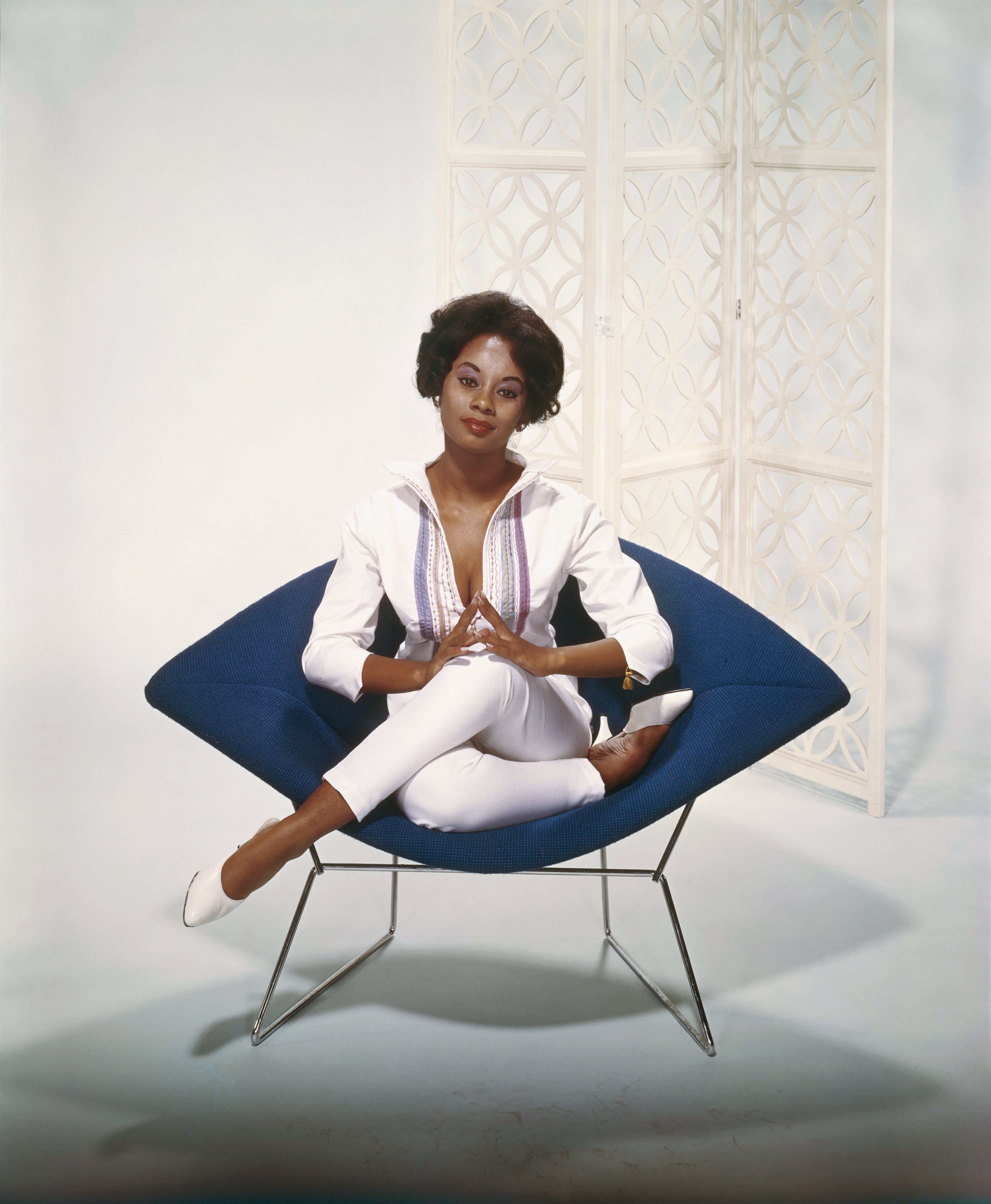Young Woman Sitting on Armchair