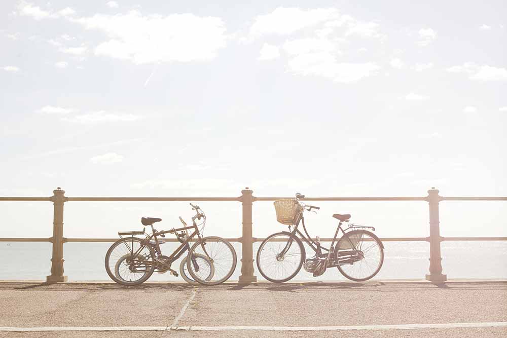 Bikes against beach railings fine art photography