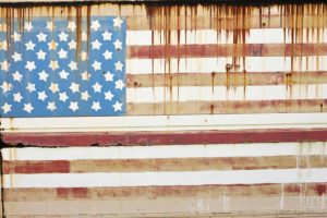 Rusting surface with American Flag painted on it