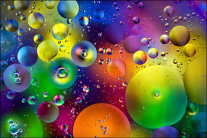 Full Frame Shot Of Multi Colored Bubbles On Glass