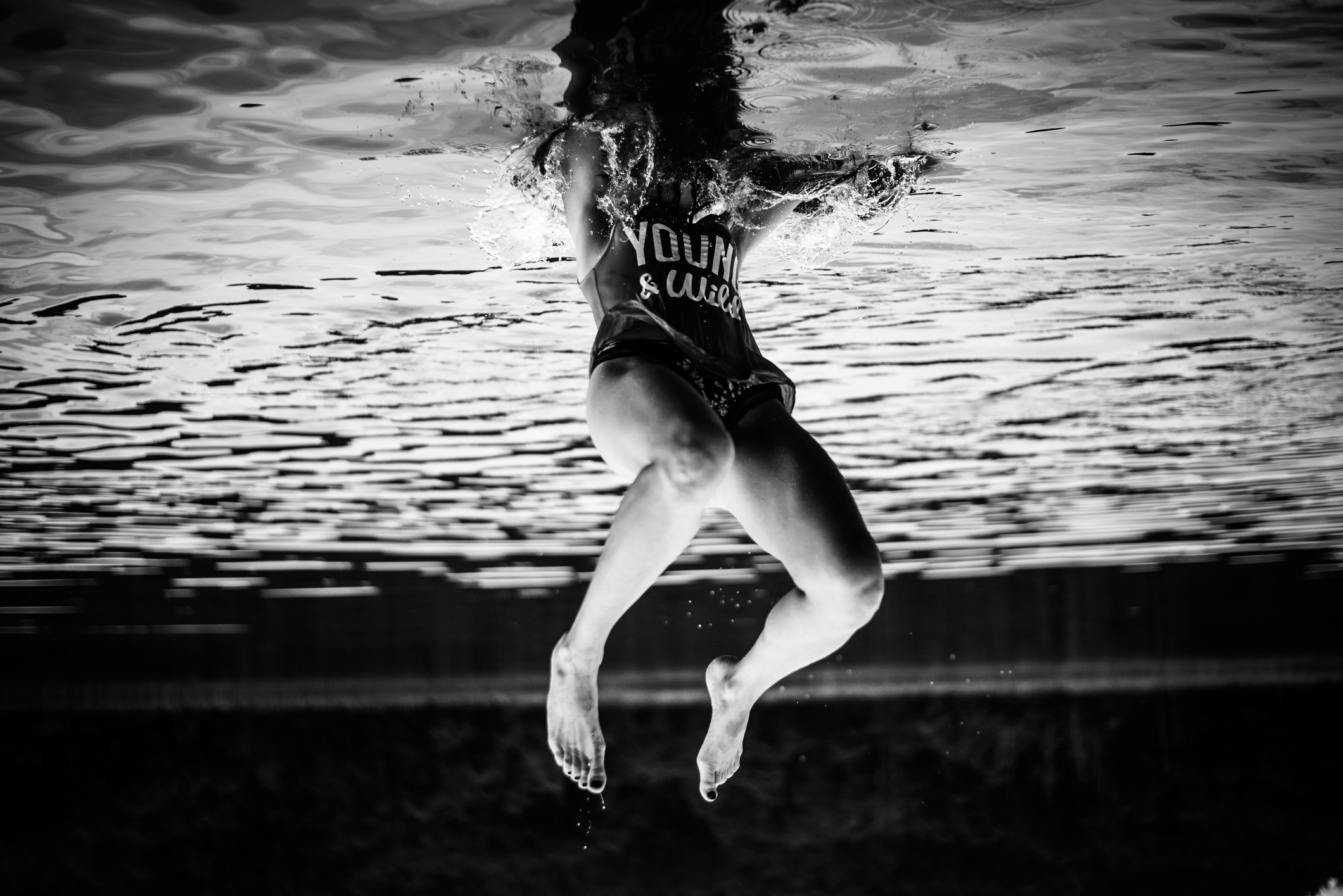Upside Down Image Of Woman Diving Into Lake fine art photography